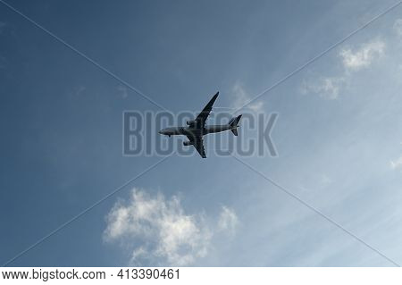 Ecouen, France - 20/02/2021 : International Flight In A Cloudy Sky