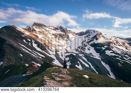 Athlete Runs On A Footpath On The Austrian Mountain Törlkopf Overlooking The Highest Peak Of The Gro