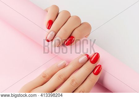 Womans Hands With Red Modern Manicure Over White Background. Manicure Design Trends