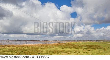 White Clouds Above The Lake In Roegwold, Netherlands