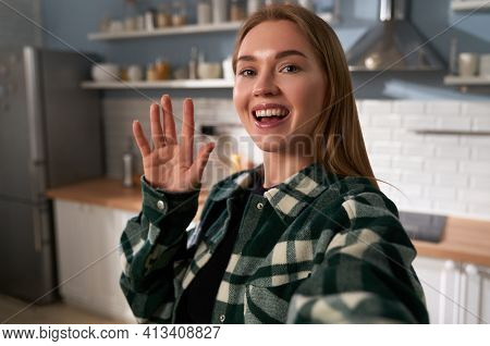 Beautiful Young Smiling Face Woman Holding Camera Or Phone In Hand And She Makes Video Call Or She I