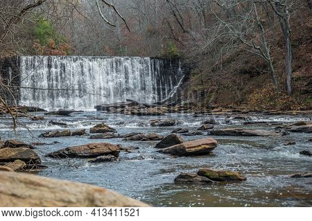 Standing Downstream On A Boulder Looking At The Waterfall Spilling Into The Creek Closeup At The Old