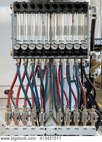 Circuit With Blue And Red Hoses Connecting Graduated Test Tubes With Pressure Gauges And Temperature