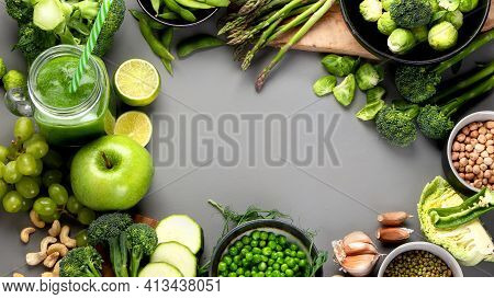 Set Of Various Green Raw Healthy Vegetables On Wooden Board