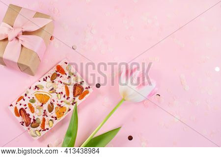 View Of Gift Box, Flower And Handmade Pink Chocolate Bar With Dried Fruits And Nuts On A Fastive Pin