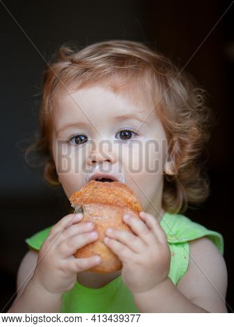 Baby With Bread. Cute Toddler Child Eating Sandwich, Self Feeding Concept