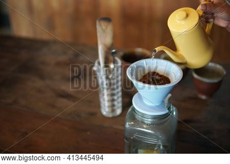 Barista Preparing Brewing Coffee With Coffee Maker And Drip Kettle.