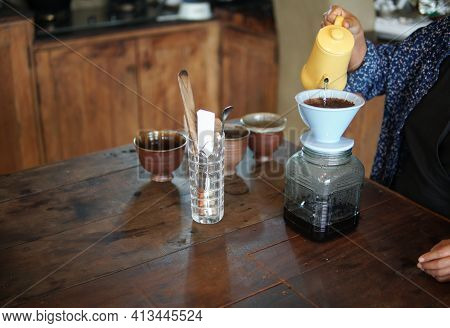 Barista Preparing Brewing Coffee With Coffee Maker And Drip Kettle.