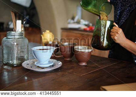 Barista Preparing Brewing Coffee With Coffee Maker And Drip Kettle.