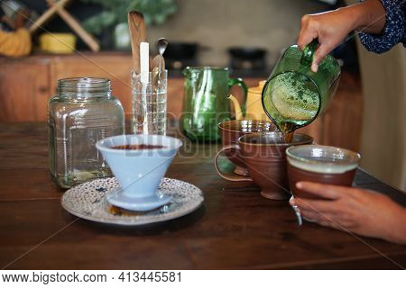 Barista Preparing Brewing Coffee With Coffee Maker And Drip Kettle.