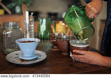 Barista Preparing Brewing Coffee With Coffee Maker And Drip Kettle.