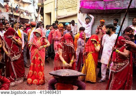 04 March 2020 Mathura, India.female Wearing Mask During Latthar Maar Holi In India.