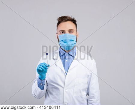 Male Doctor In Protective Mask And Gloves Holding Sterile Swab Stick For Coronavirus Pcr Test On Gre