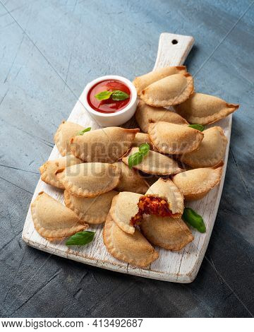 Margarita Margherita Pizza Parcels Pockets Filled With Tomato, Mozzarella Cheese And Basil Served On