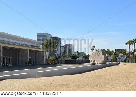 LOS ANGELES - NOVEMBER 24, 2017: Levitated Mass art installation at the Los Angeles County Museum of Art. By Michael Heizer it weighs 340 tons with a trench visitors can walk through.