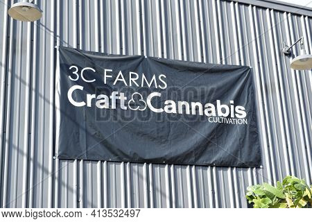 LOS ANGELES, CALIFORNIA - 05 FEB 2020: 3C Farms Craft and Cannabis Cultivation sign, a high-end cannabis cultivator that distributes to its affiliate storefronts.