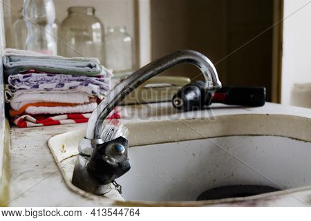 Kitchen In An Old-run Flat Of A Panel Houe