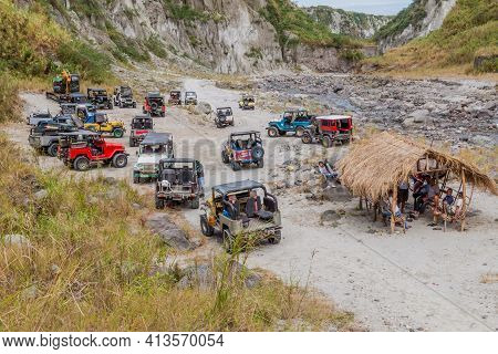 Mt Pinatubo, Philippines - Jan 30, 2018: Tourist Vehicles On A Lahar Mudflow Remnant At Pinatubo Vol