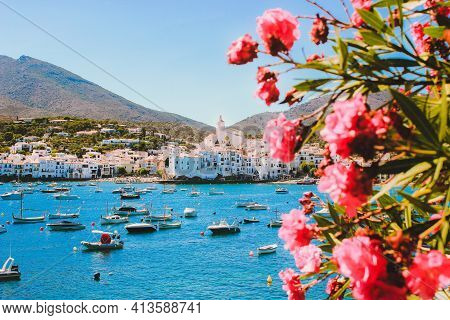 Mediterranean Coast. White Houses, Turquose Sea And Yachts. Cadaqués Village On The Mediterranean Se