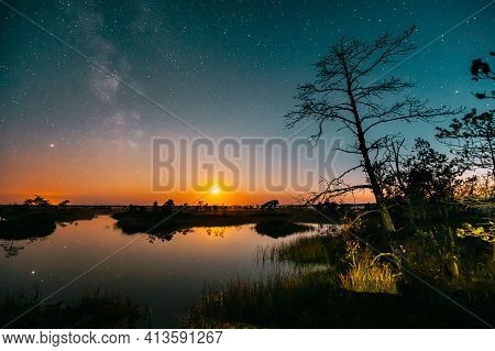 Lake Nature Landscape. Night Starry Sky Milky Way Galaxy With Glowing Stars And Moon. Nature Hyperla