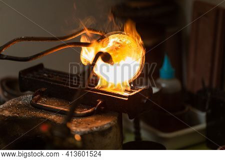 Melting With Blow Torch And Foundry Of Liquid Silver From A Bowl Into A Mold