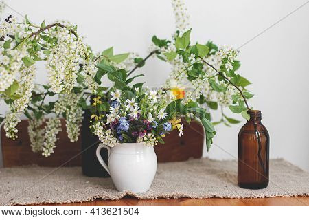 Beautiful Spring Wildflowers On Rustic Wooden Table. Spring Rural Still Life. Blooming Flowers