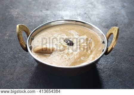 Close-up Of Korma, An Oriental Dish On Black Stony Background. Traditional Indian Cuisine. Curry, Sw