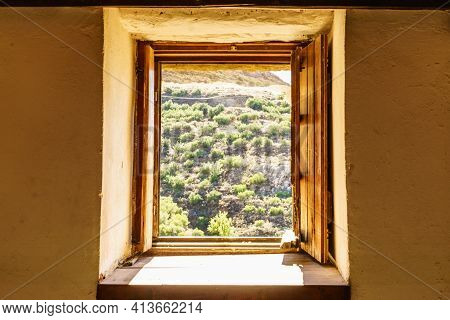 Window Frame Made Of Brown Wood. Old Construction, Ancient Architecture. Enterior Details.