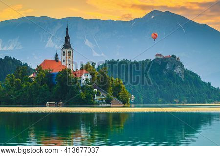 Amazing Alpine Destination With Colorful Hot Air Ballon Over The Bled Castle And Lake At Dawn, Bled,
