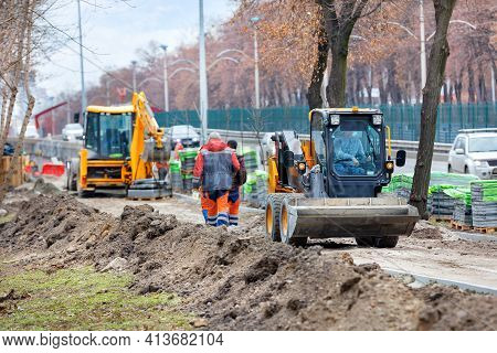 The Compact Road Grader Levels Sandy Soil And Prepares The Pavement Under Construction For Tiling Al