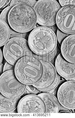 Surface Of Many Russian Coins Of 10 Rubles. Black And White Vertical Dramatic Illustration. Economy,