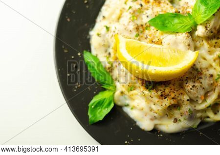 Carbonara, Spaghetti With A Cheese And Smoked Bacon Sauce Topped With Chicken Breast Pieces And Rega