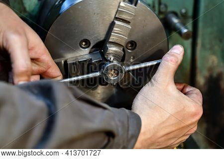 A Turner Cuts A Thread With A Lathe On A Lathe.