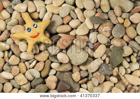 Plasticine Star On Sea Shingle