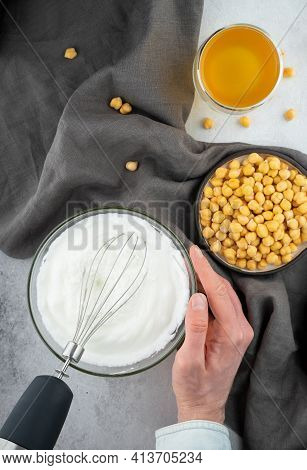 Chickpea Aquafaba. Egg Replacement. Vegan Cooking Concept. Men Hands Whippe Whisk Chickpeas Liquid I