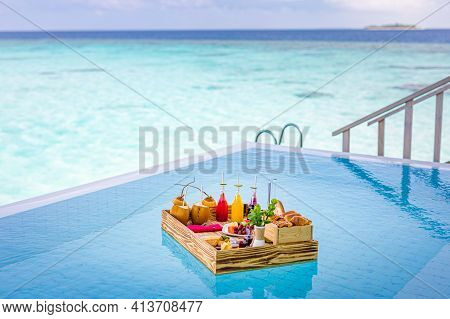 Breakfast In Swimming Pool, Floating Breakfast In Luxurious Tropical Hotel Resort. Table Relaxing On