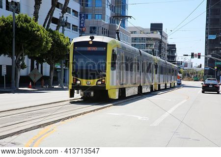Long Beach, California - USA - March 15, 2021: Los Angeles Metro Blue Line in Downtown Long Beach California. Metrolink Train System transports people around in Southern California. Editorial use only