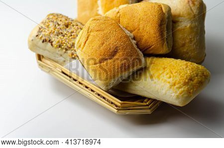 Various Types Of Bread Served On A Wicker Tray, Delicious And Fresh Rolls