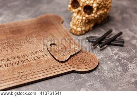 Mediumship Divination Equipment. Ouija Board On Grey Background.fortune Teller And Black Magic Conce
