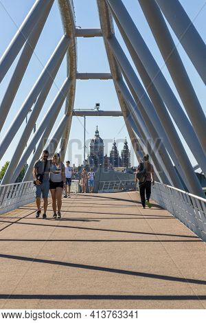 Amsterdam, Netherlands - July 02, 2018: People Walk The Bridge That Leads To The Nemo Museum Buildin