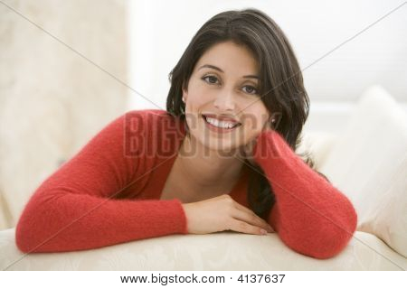 Woman Sitting In Living Room