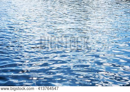 Ripples On Lake Water. Ocean Wave Background. Wavy Pond Texture. Messy Water Flow. Blue Water Surfac