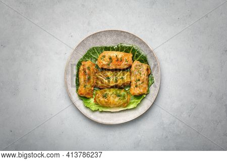 Golubtsi Or Golabki On Gray Plate On Concrete Table Top. Stuffed Cabbage Rolls Dish Of Russian, Poli