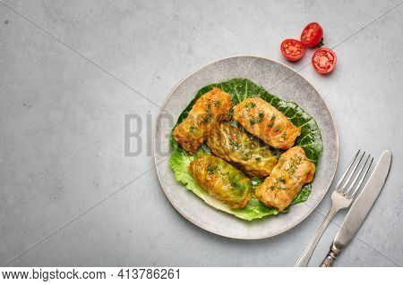 Golubtsi Or Golabki On Gray Plate On Concrete Table Top. Stuffed Cabbage Rolls Dish Of Russian, Poli