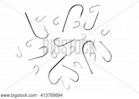 Fish Hooks Of Different Sizes On A White Background, Close-up