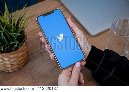 Alanya, Turkey - February 26 2021: Woman Hand Holding Iphone 12 Pro Max Gold With Social Networking 