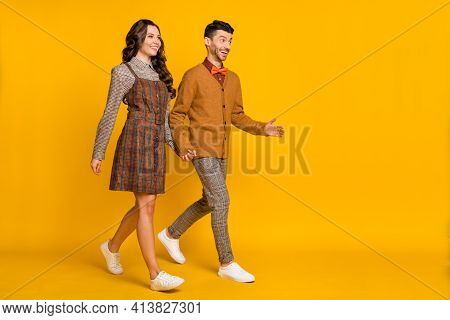 Full Size Photo Of Man And Woman Walk Empty Space Wear Plaid Dress Pants Bowtie Jumper Isolated On Y