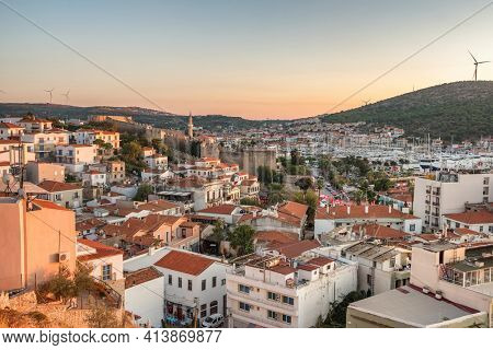 Cesme cityscape at Aegean sea coast at sunset, Turkey