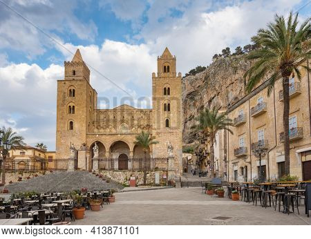 Panoramic view of Cathedral Basilica of Cefalu or Duomo di Cefalu and square Piazza del Duomo in the old town of coastal city Cefalu, Sicily, Italy