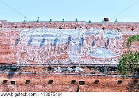 SANTA ANA, CALIFORNIA - 20 AUG 2020: Original Mikeâs Restaurant, on Main Street, occupies what was once Santa Anaâs first Buick-Horseless Carriage Auto Dealership built in 1919.
